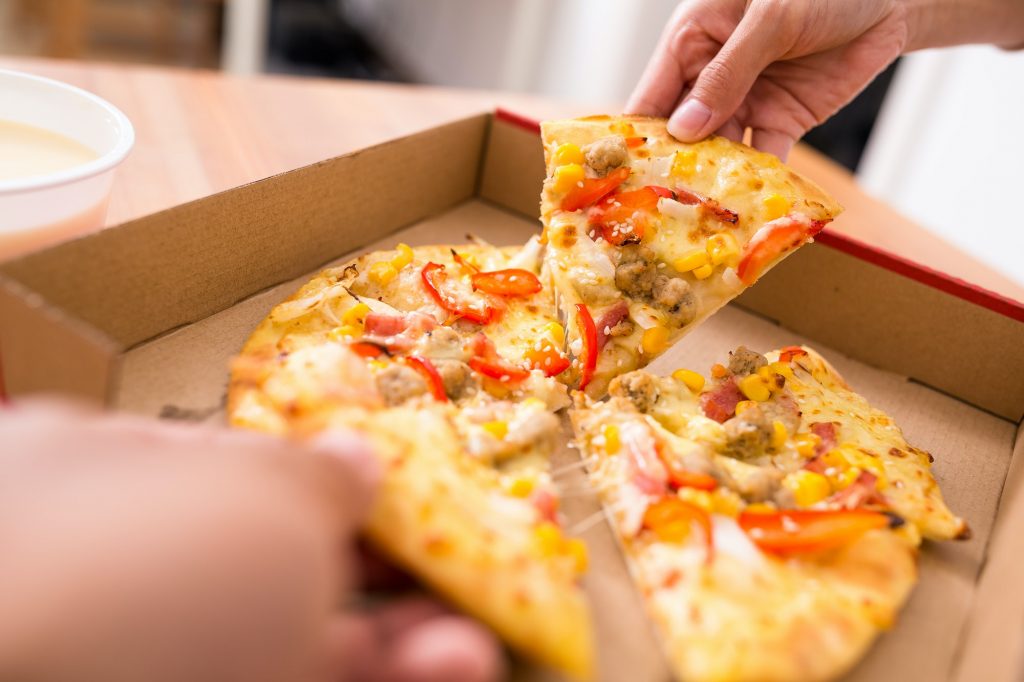 Friend sharing pizza