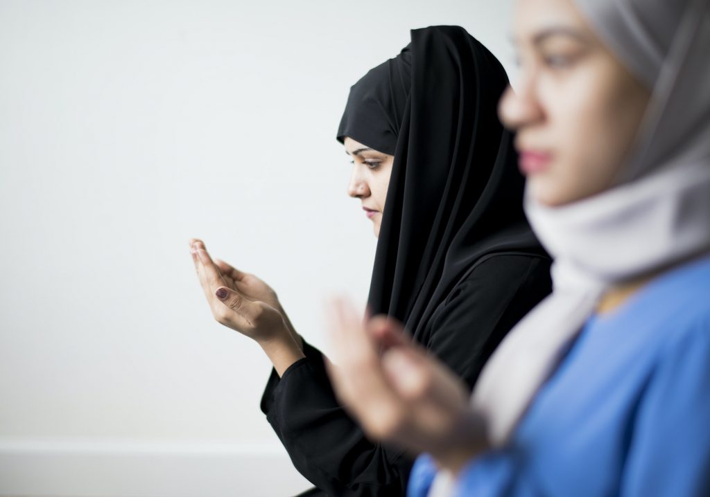 Muslim women making Dua to Allah