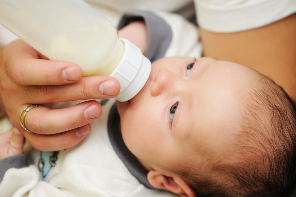 Dad feeding his baby