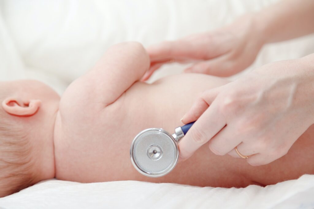 Stethoscope listening to baby newborn's heart beat or lungs