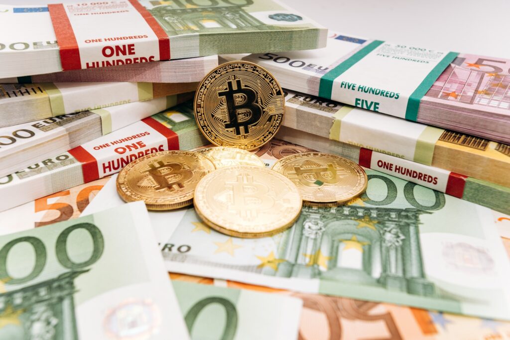 Crypto currency concept - a bitcoin with euro bills.